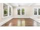 Sunlit living room with hardwood floors and multiple windows at 776 Brookline Sw St, Atlanta, GA 30310