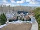 Stone house aerial view, snow on ground at 7801 Windswept Way, Douglasville, GA 30135