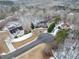 Aerial view of neighborhood with houses covered in a light layer of snow at 7801 Windswept Way, Douglasville, GA 30135