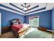 Main bedroom with tray ceiling and ensuite bathroom at 7801 Windswept Way, Douglasville, GA 30135