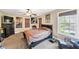 Cozy bedroom with double bed and large windows at 7801 Windswept Way, Douglasville, GA 30135