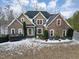 Brick home with snow covered lawn at 7801 Windswept Way, Douglasville, GA 30135