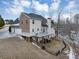 House exterior with a brick and siding facade, a deck, and a sloping yard at 7801 Windswept Way, Douglasville, GA 30135