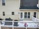 Back deck with snow on the ground and a view of the house exterior at 7801 Windswept Way, Douglasville, GA 30135