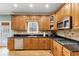 Modern kitchen with granite countertops and gas cooktop at 7801 Windswept Way, Douglasville, GA 30135