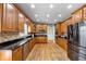 Spacious kitchen with light wood cabinets and granite countertops at 7801 Windswept Way, Douglasville, GA 30135