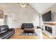 Two-story living room with fireplace and hardwood floors at 7801 Windswept Way, Douglasville, GA 30135