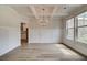 Elegant dining room with coffered ceiling, chandelier, and wainscoting at 123 Felicity Pike, Locust Grove, GA 30248