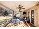 Relaxing back patio with covered seating area and ceiling fan at 928 Buckhorn Bnd, Locust Grove, GA 30248