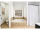 Bathroom with soaking tub and shower combo at 928 Buckhorn Bnd, Locust Grove, GA 30248