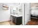 Clean bathroom with double vanity, tile floor, and access to bedroom at 928 Buckhorn Bnd, Locust Grove, GA 30248