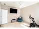 Spacious bedroom with Peloton bike and large TV at 928 Buckhorn Bnd, Locust Grove, GA 30248