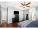 Main bedroom with large bed, dresser, and access to bathroom at 928 Buckhorn Bnd, Locust Grove, GA 30248
