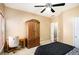 Bedroom with wooden armoire and home office setup at 928 Buckhorn Bnd, Locust Grove, GA 30248