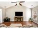 Vaulted ceiling, hardwood floors, and fireplace at 928 Buckhorn Bnd, Locust Grove, GA 30248
