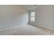 Upstairs bedroom with neutral walls and carpeted floor at 115 Felicity Pike, Locust Grove, GA 30248