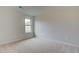 Upstairs bedroom with neutral walls and carpeted floor at 115 Felicity Pike, Locust Grove, GA 30248