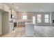 Modern kitchen with island and stainless steel appliances at 115 Felicity Pike, Locust Grove, GA 30248