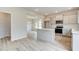 Modern kitchen features island, stainless steel appliances, and light gray cabinets at 115 Felicity Pike, Locust Grove, GA 30248