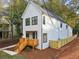 Modern farmhouse with a large backyard and wood fence at 2438 2Nd Nw St, Atlanta, GA 30318