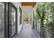 Private balcony with treed views and modern metal railing at 2438 2Nd Nw St, Atlanta, GA 30318