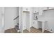 Basement kitchenette with white cabinets and sink at 2438 2Nd Nw St, Atlanta, GA 30318