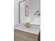 Vanity with gold faucet and a modern framed mirror at 2438 2Nd Nw St, Atlanta, GA 30318