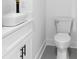 Small bathroom with gray tile and modern vanity at 2438 2Nd Nw St, Atlanta, GA 30318