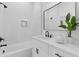 Modern bathroom with white vanity, a frameless mirror, and black fixtures at 2438 2Nd Nw St, Atlanta, GA 30318