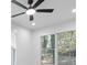 Bright bedroom with ceiling fan and large windows at 2438 2Nd Nw St, Atlanta, GA 30318