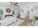 Primary bedroom with sitting area, access to other rooms, and stylish decor at 2438 2Nd Nw St, Atlanta, GA 30318