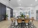 Elegant dining area with a long table and modern lighting at 2438 2Nd Nw St, Atlanta, GA 30318