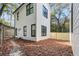 Two-story home with white siding and black trim at 2438 2Nd Nw St, Atlanta, GA 30318