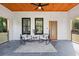 Inviting front porch with rocking chairs and a wood ceiling at 2438 2Nd Nw St, Atlanta, GA 30318