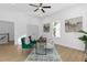 Bright home office features hardwood floors, a workspace, and two green velvet chairs at 2438 2Nd Nw St, Atlanta, GA 30318