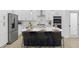 Spacious kitchen island with seating, white cabinets, and stainless steel appliances at 2438 2Nd Nw St, Atlanta, GA 30318