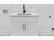 White cabinetry, quartz countertop, and a laundry sink at 2438 2Nd Nw St, Atlanta, GA 30318