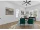 Bright home office with hardwood floors and two velvet armchairs at 2438 2Nd Nw St, Atlanta, GA 30318