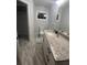 Bathroom with granite countertop vanity and updated flooring at 3006 Dogwood Dr, Hapeville, GA 30354