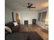 Living room with hardwood floors, fireplace, and ceiling fan at 3006 Dogwood Dr, Hapeville, GA 30354