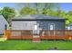 Back of house featuring a deck and lush green grass in backyard at 639 Ozburn, Atlanta, GA 30318