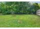 Lush backyard with mature trees and green space provides a serene and private setting at 639 Ozburn, Atlanta, GA 30318
