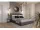 Elegant bedroom with a gray upholstered bed and stylish decor at 639 Ozburn, Atlanta, GA 30318