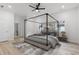 Beautifully staged bedroom with a four-poster bed, stylish rug, and modern furnishings at 639 Ozburn, Atlanta, GA 30318