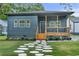 Charming single-story home featuring a welcoming front porch, stone walkway, and beautifully landscaped front yard at 639 Ozburn, Atlanta, GA 30318