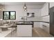 Modern kitchen with white cabinets and marble countertops at 639 Ozburn, Atlanta, GA 30318