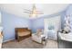 Charming Bedroom with light blue walls and plenty of storage at 1907 Kelvin Dr, Lawrenceville, GA 30043