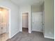 Bedroom with bathroom access, walk-in closet, and neutral decor at 2920 Ilir Nw Mnr, Atlanta, GA 30318