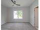 Spacious bedroom with ceiling fan, large window, and plush carpeting at 2920 Ilir Nw Mnr, Atlanta, GA 30318
