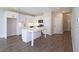 Open kitchen with white cabinets, large island, and stainless steel appliances at 2920 Ilir Nw Mnr, Atlanta, GA 30318